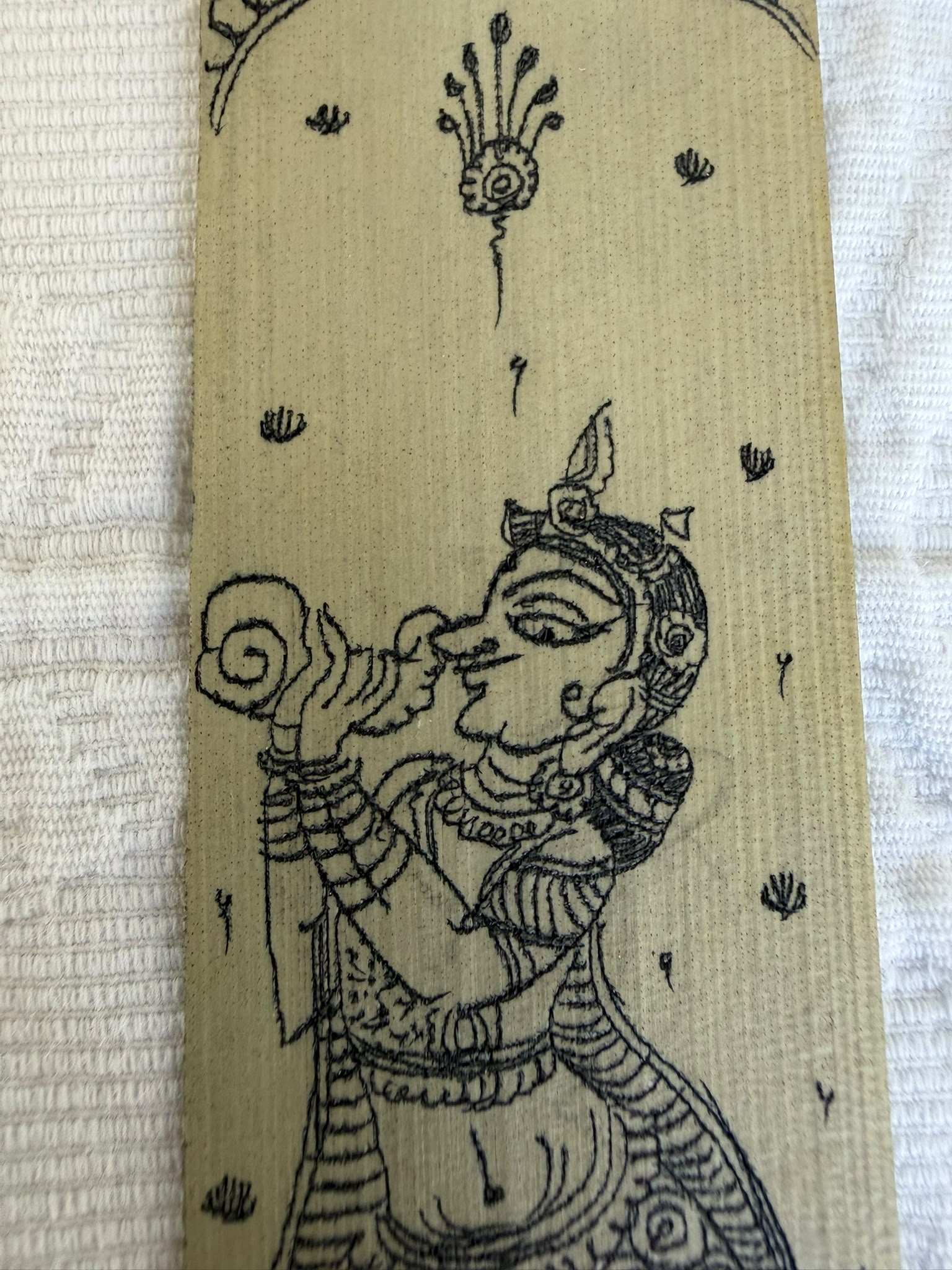 Conch Bearer Bookmark – The Sound of Auspicious Beginnings – Hand-Drawn Pattachitra on Palm Leaf